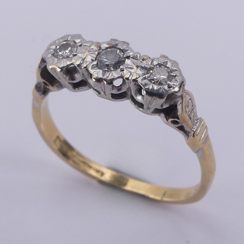 183 - A small three stone diamond Ring, illusion set in 18ct yellow gold and platinum, Size N, 2.9g.... 