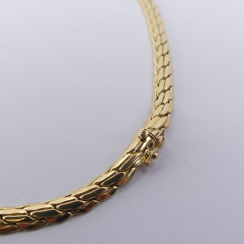 252 - A graduated 18ct yellow gold Necklace, formed of stylised textured and polished bricklinks, with int... 