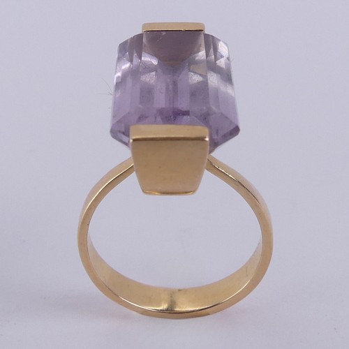 184 - An amethyst Dress Ring, the pale emerald cut stone mounted in 18ct yellow gold, with French marks, 2... 