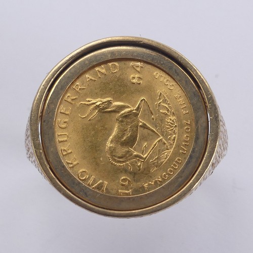 342 - A South African 1/10oz Krugerrand, dated 1984, in 9ct gold ring mount, Size V, 7.8g.... 