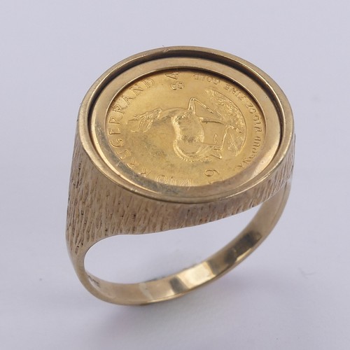 342 - A South African 1/10oz Krugerrand, dated 1984, in 9ct gold ring mount, Size V, 7.8g.... 