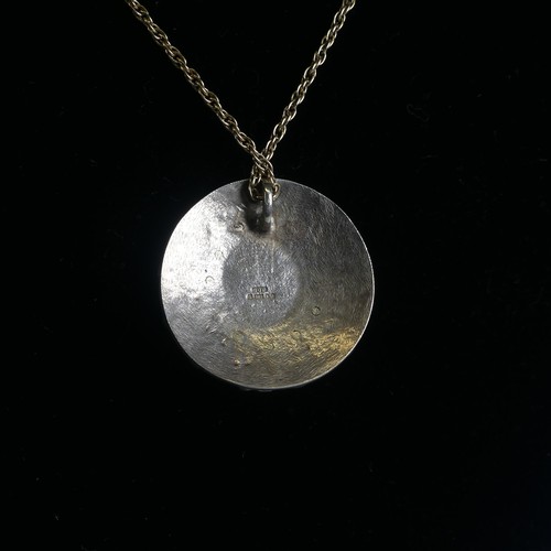 255 - A 9ct white gold circular Pendant, the centre set opaline, 2.9cm diameter, hallmarked London 1991, o... 