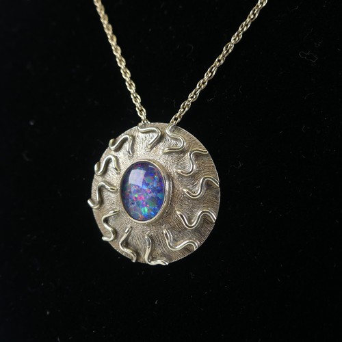 255 - A 9ct white gold circular Pendant, the centre set opaline, 2.9cm diameter, hallmarked London 1991, o... 