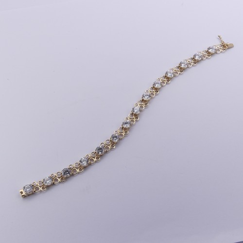 272 - A cubic zirconia Bracelet, the thirteen brilliant cut stones approx. 6mm diameter, claw set in 14ct ... 