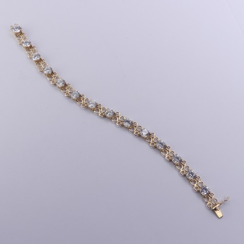 272 - A cubic zirconia Bracelet, the thirteen brilliant cut stones approx. 6mm diameter, claw set in 14ct ... 