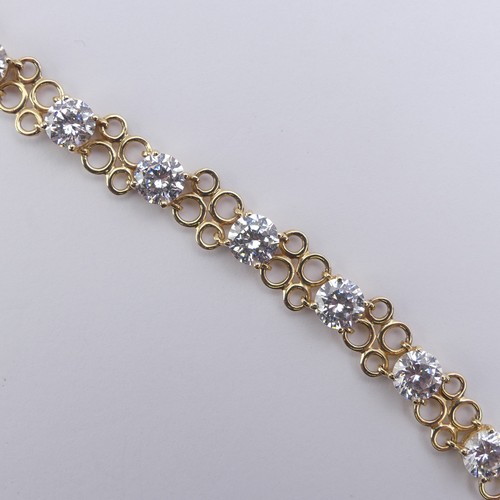 272 - A cubic zirconia Bracelet, the thirteen brilliant cut stones approx. 6mm diameter, claw set in 14ct ... 