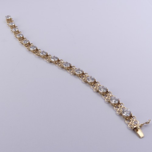 272 - A cubic zirconia Bracelet, the thirteen brilliant cut stones approx. 6mm diameter, claw set in 14ct ... 