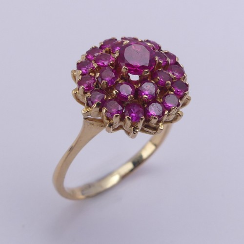 195 - A ruby cluster Ring, the circular synthetic pink stones claw set in unmarked yellow metal, tested as... 