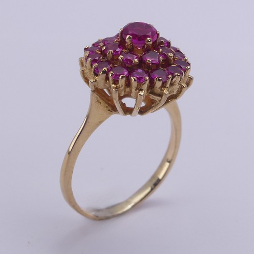 195 - A ruby cluster Ring, the circular synthetic pink stones claw set in unmarked yellow metal, tested as... 