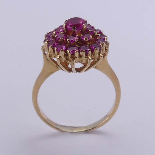 195 - A ruby cluster Ring, the circular synthetic pink stones claw set in unmarked yellow metal, tested as... 