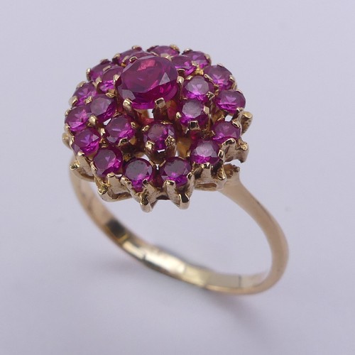 195 - A ruby cluster Ring, the circular synthetic pink stones claw set in unmarked yellow metal, tested as... 