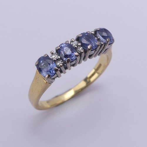 201 - A sapphire and diamond Ring, the four oval facetted cornflower blue sapphires approx. 4.2mm long, cl... 