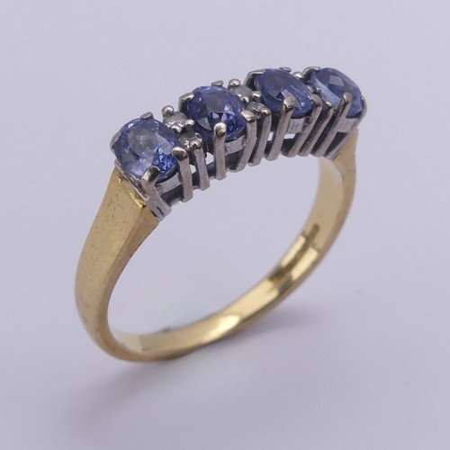 201 - A sapphire and diamond Ring, the four oval facetted cornflower blue sapphires approx. 4.2mm long, cl... 