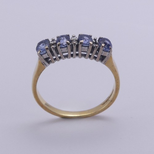 201 - A sapphire and diamond Ring, the four oval facetted cornflower blue sapphires approx. 4.2mm long, cl... 