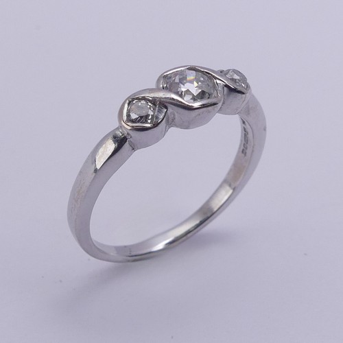 208 - A three stone diamond Ring, the centre stone approx. 0.25ct with a smaller stone on either side, all... 