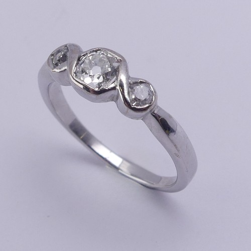 208 - A three stone diamond Ring, the centre stone approx. 0.25ct with a smaller stone on either side, all... 