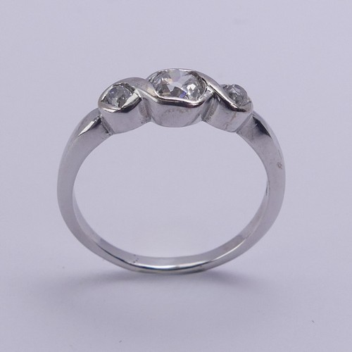 208 - A three stone diamond Ring, the centre stone approx. 0.25ct with a smaller stone on either side, all... 