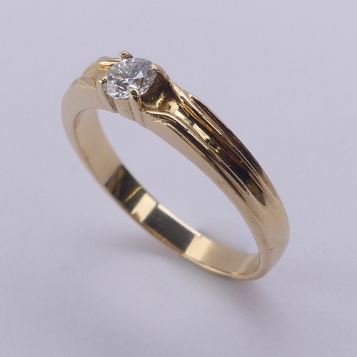 209 - A single stone diamond Ring, the brilliant cut stone approx. 0.24ct, four claw set in 18ct yellow go... 