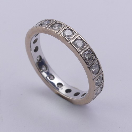 211 - A diamond full Eternity Ring, with twenty circular stones in squared mounts, total diamond weight ap... 