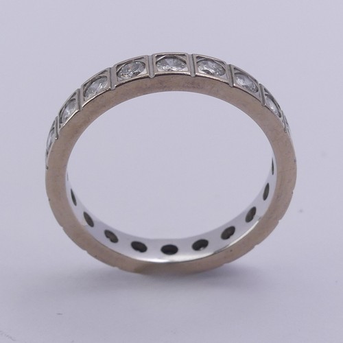 211 - A diamond full Eternity Ring, with twenty circular stones in squared mounts, total diamond weight ap... 