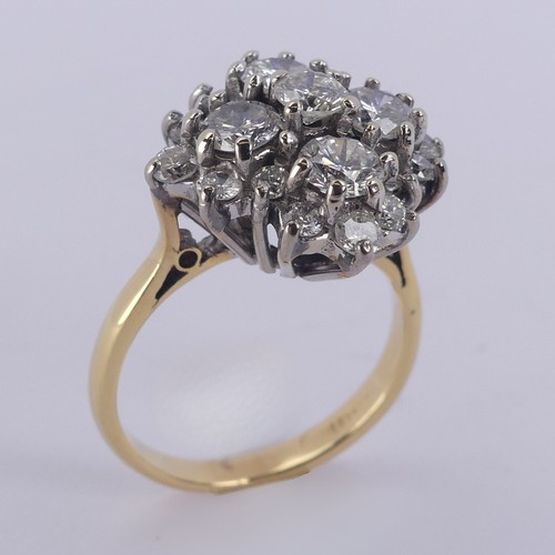 212 - A diamond cluster Dress Ring, the largest four stones each approx. 0.3ct around a smaller central st... 