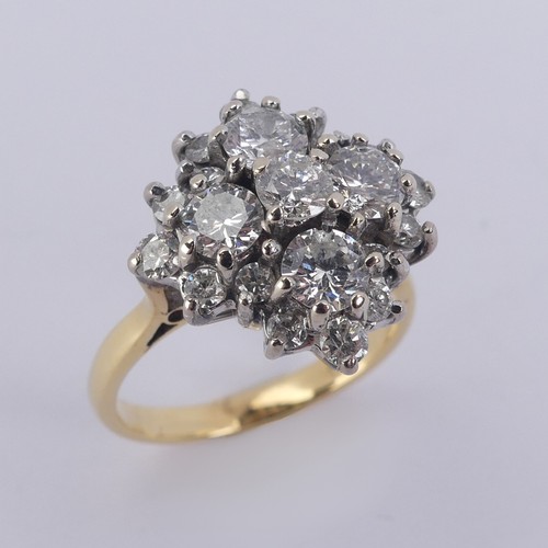 212 - A diamond cluster Dress Ring, the largest four stones each approx. 0.3ct around a smaller central st... 