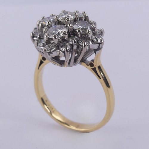 212 - A diamond cluster Dress Ring, the largest four stones each approx. 0.3ct around a smaller central st... 