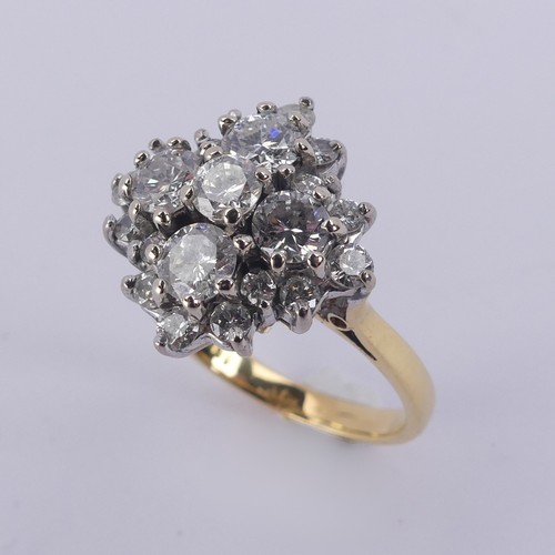 212 - A diamond cluster Dress Ring, the largest four stones each approx. 0.3ct around a smaller central st... 