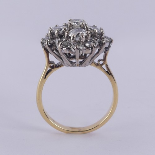 212 - A diamond cluster Dress Ring, the largest four stones each approx. 0.3ct around a smaller central st... 