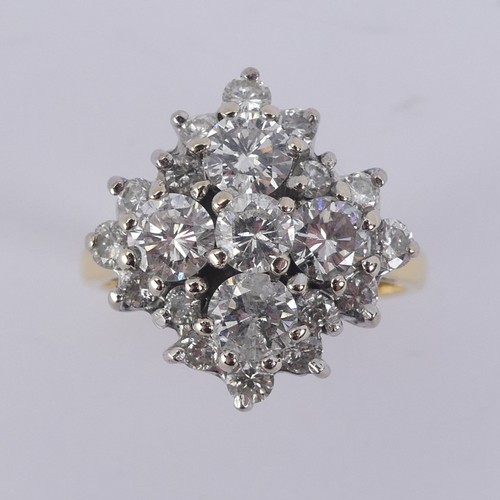 212 - A diamond cluster Dress Ring, the largest four stones each approx. 0.3ct around a smaller central st... 