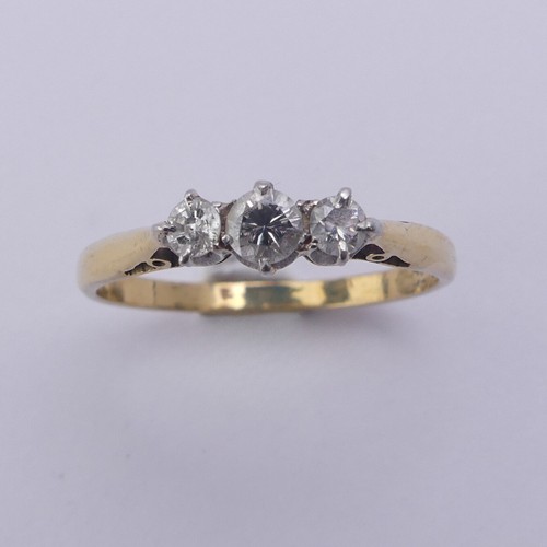 215 - A small three stone diamond Ring, approx. total diamond weight 0.24ct, mounted in 18ct yellow gold a... 