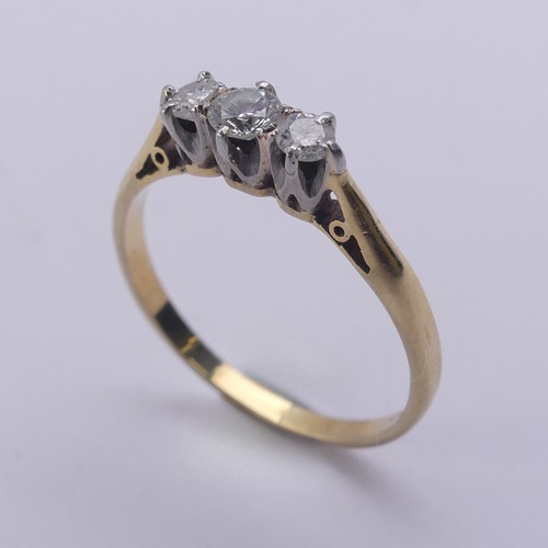 215 - A small three stone diamond Ring, approx. total diamond weight 0.24ct, mounted in 18ct yellow gold a... 