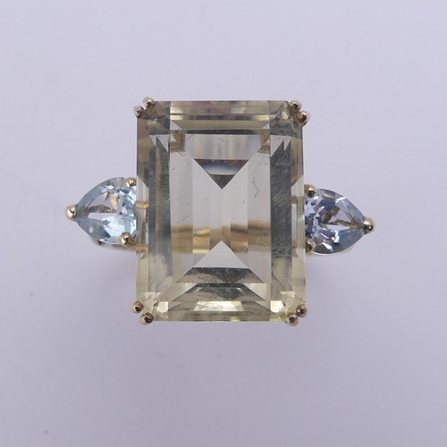 221 - A QVC citrine Dress Ring, the emerald cut stone 15.8mm x 11.9mm with a pear shaped pale blue stone o... 