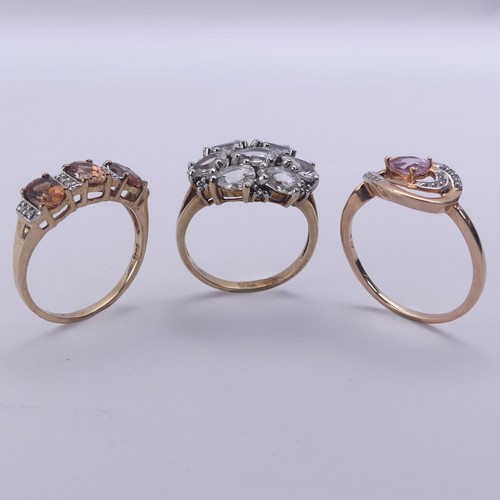 222 - Three 9ct gold gem set Rings, one with pear shaped white stones, Size N, the other two 'TV Channel' ... 