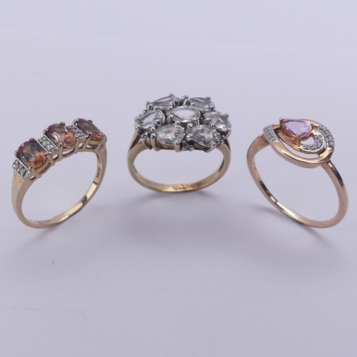 222 - Three 9ct gold gem set Rings, one with pear shaped white stones, Size N, the other two 'TV Channel' ... 