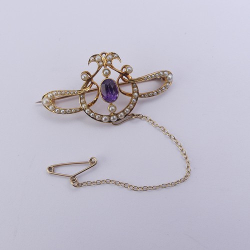 280 - An Edwardian amethyst and seed pearl Brooch, all mounted in 15ct yellow gold, 4.2cm long, 5.5g, in a... 