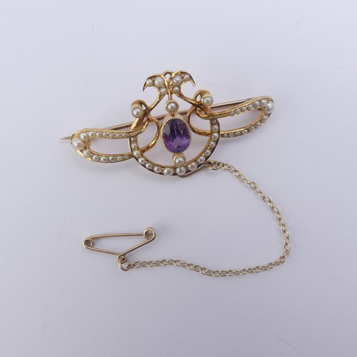 280 - An Edwardian amethyst and seed pearl Brooch, all mounted in 15ct yellow gold, 4.2cm long, 5.5g, in a... 