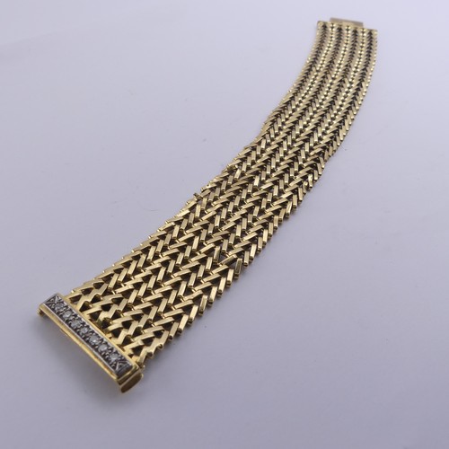 273 - An 18ct yellow gold mesh Bracelet, with integral clasp and diamond set safety bar, 2.8cm wide, 19cm ... 