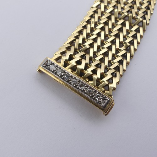 273 - An 18ct yellow gold mesh Bracelet, with integral clasp and diamond set safety bar, 2.8cm wide, 19cm ... 