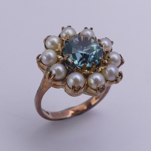 231 - A blue topaz and cultured pearl Dress Ring, cluster diameter 17.75mm, mounted in 9ct yellow gold, Si... 