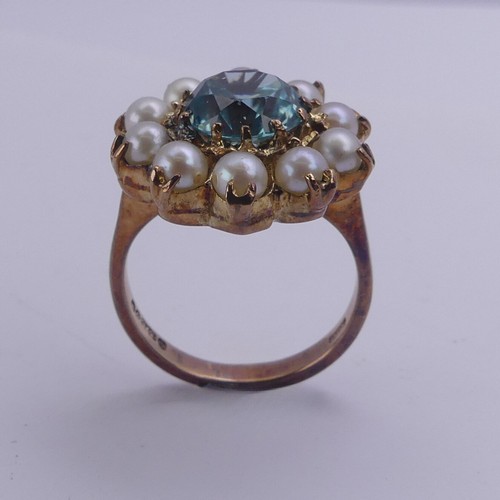 231 - A blue topaz and cultured pearl Dress Ring, cluster diameter 17.75mm, mounted in 9ct yellow gold, Si... 