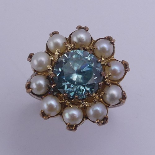 231 - A blue topaz and cultured pearl Dress Ring, cluster diameter 17.75mm, mounted in 9ct yellow gold, Si... 