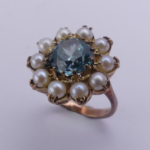 231 - A blue topaz and cultured pearl Dress Ring, cluster diameter 17.75mm, mounted in 9ct yellow gold, Si... 