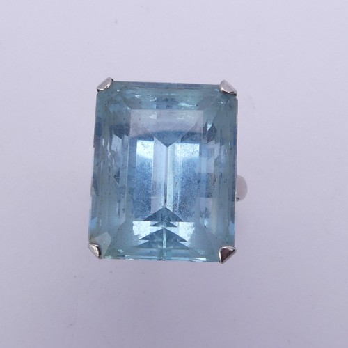 232 - A large aquamarine Dress Ring, the stone approx. 20ct (18mm x 14.4mm x 11.3mm) mounted in unmarked w... 