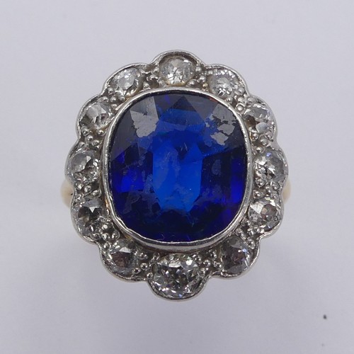 233 - A blue stone and diamond cluster Ring, the cushion shaped central facetted blue stone, possibly synt... 