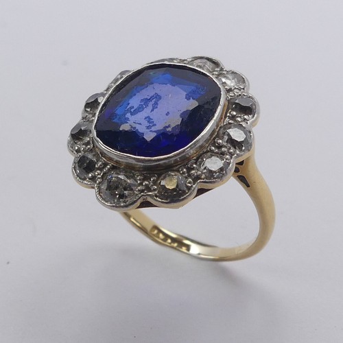 233 - A blue stone and diamond cluster Ring, the cushion shaped central facetted blue stone, possibly synt... 