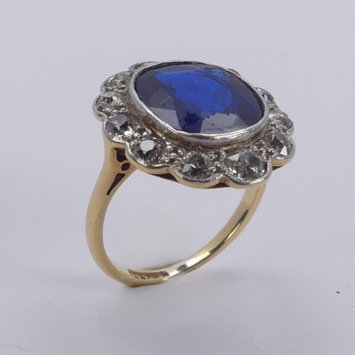 233 - A blue stone and diamond cluster Ring, the cushion shaped central facetted blue stone, possibly synt... 