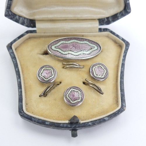 329 - A vintage cased silver and enamel Brooch and Button set, the fronts with pink and white guilloche en... 