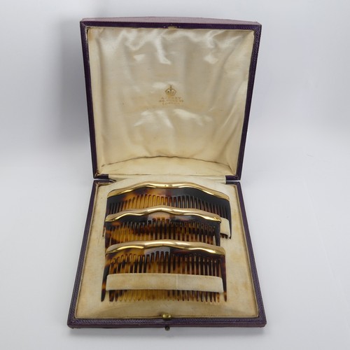 330 - Asprey; An early 20thC cased trio of graduated tortoiseshell Combs / Hair Ornaments, of domed form w... 