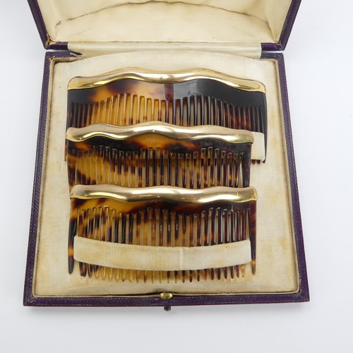 330 - Asprey; An early 20thC cased trio of graduated tortoiseshell Combs / Hair Ornaments, of domed form w... 